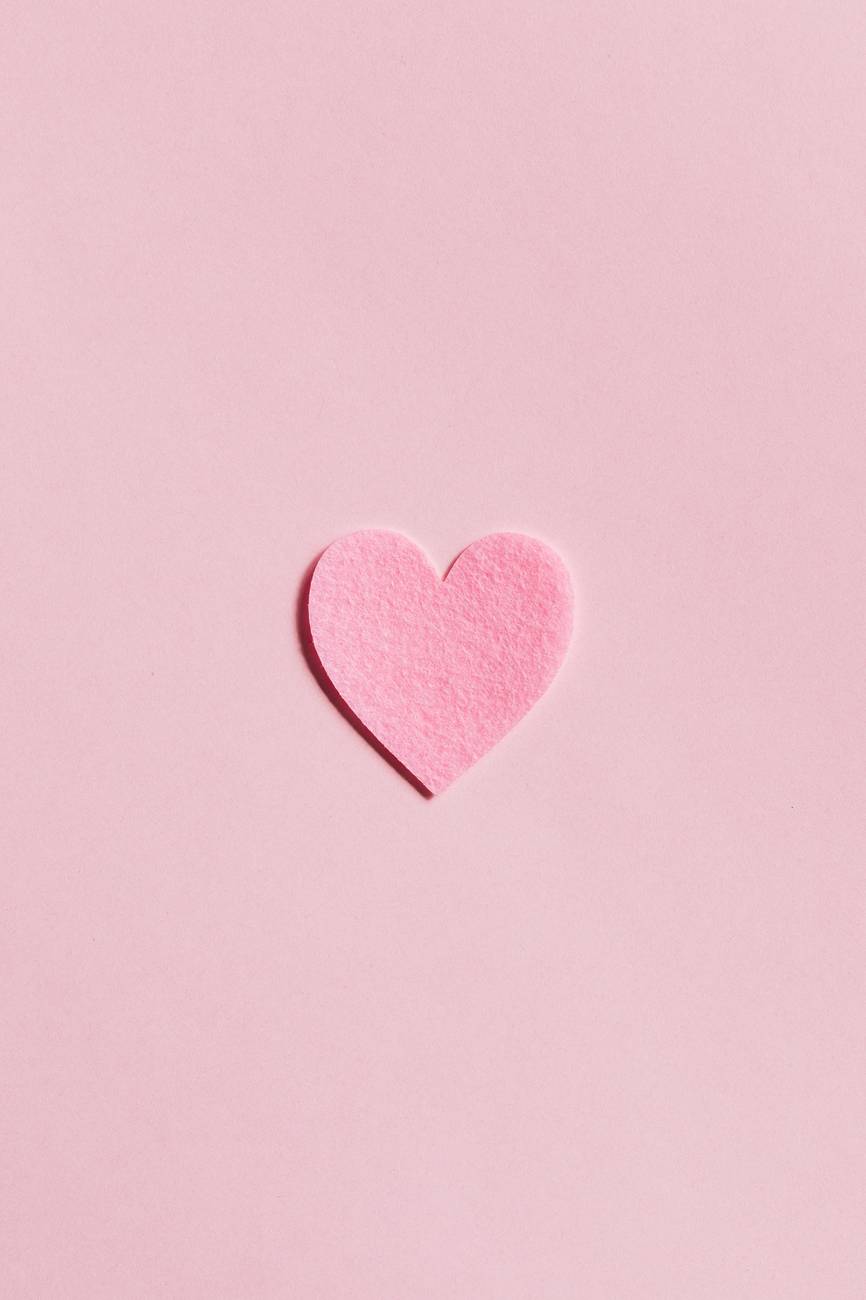 paper heart on light pink background